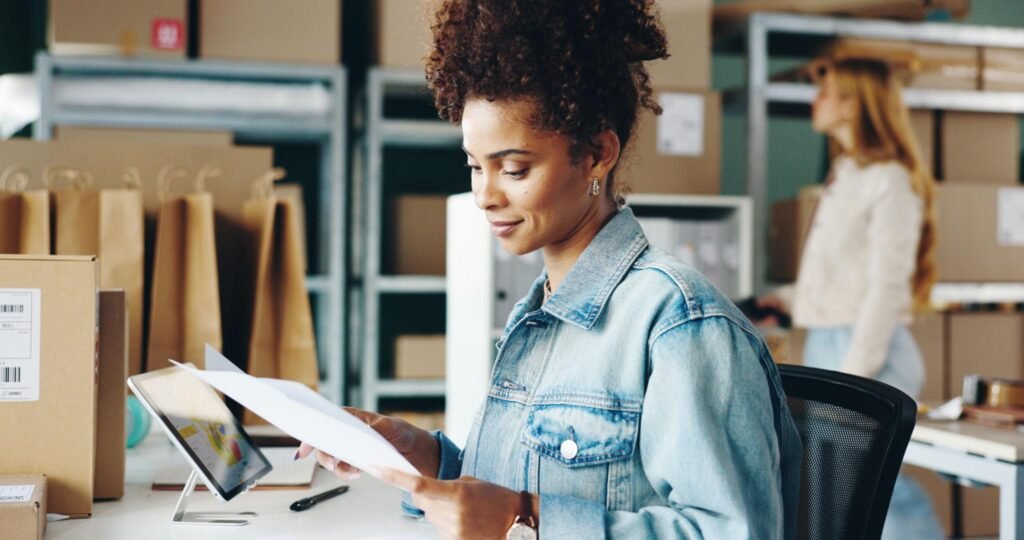 Order fulfillment staff checking shipping documents and package details